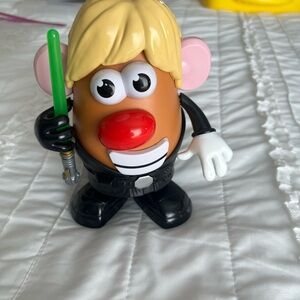 Kids Action Figure Potato Character with Blonde Hair and Green Lightsaber